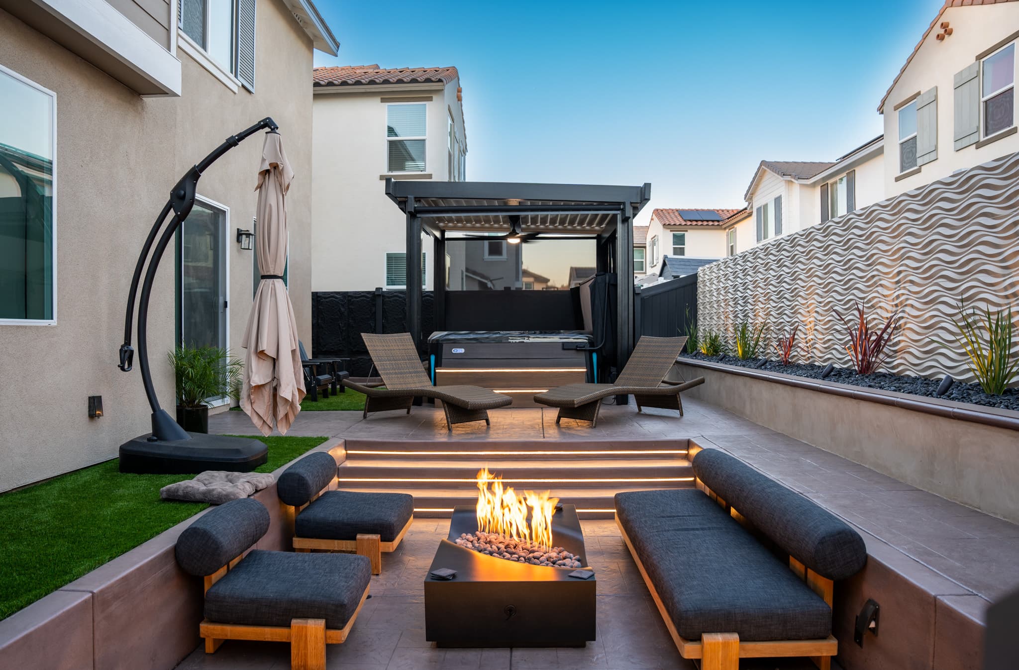 backyard design with fire pit, lounge area, jacuzzi, etc.