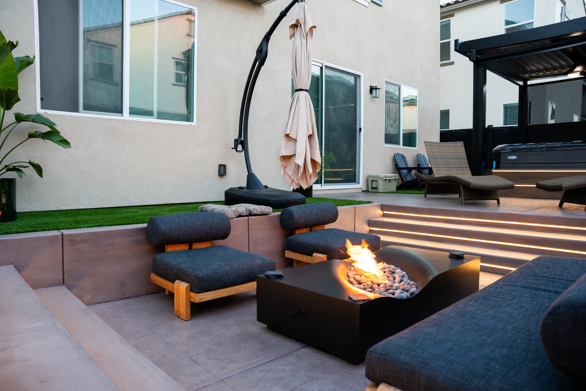 backyard design with fire pit, lounge area, jacuzzi, etc.