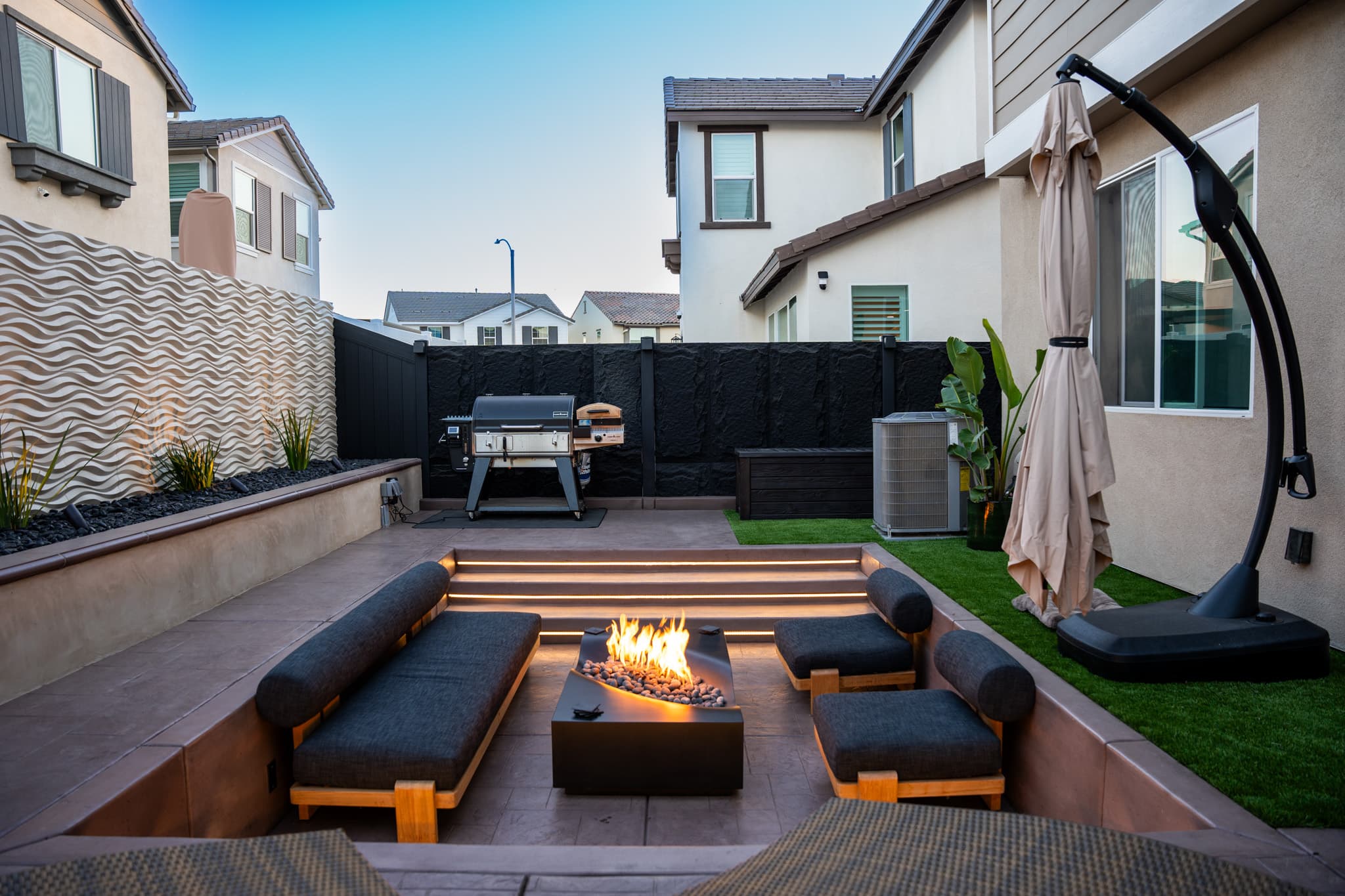 backyard design with fire pit, lounge area, jacuzzi, etc.