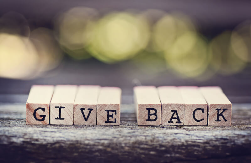 Give Back written on wooden blocks