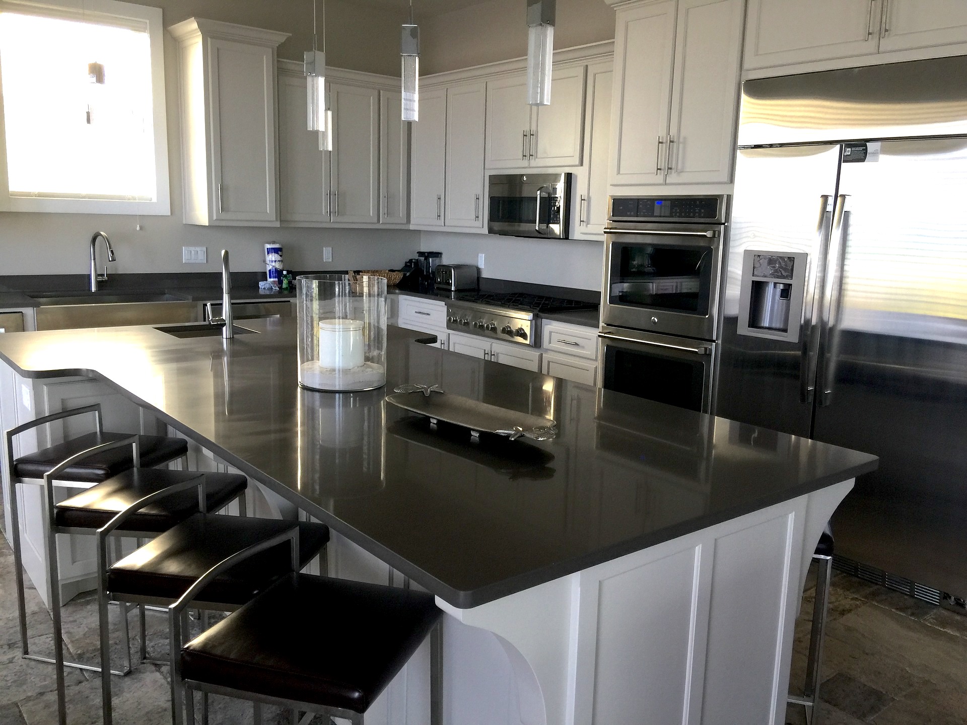 White cabinets and black counters in a newly renovated kitchen