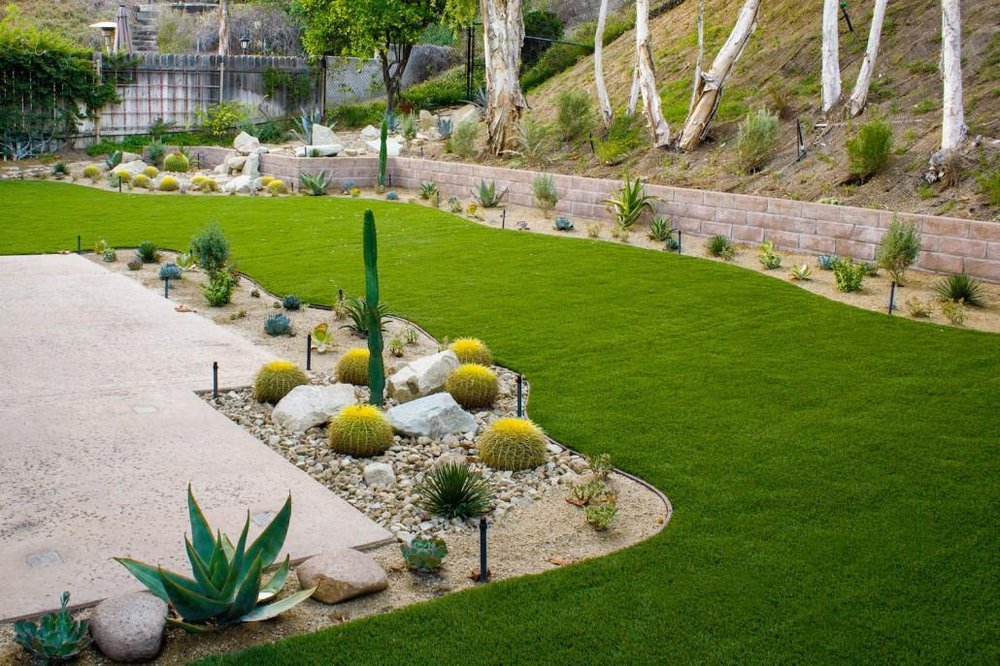 San Diego Landscape Remodel with stamped retaining wall hardscape feature and softscape with succulents