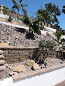 Embankment with stone and cinder block retaining walls