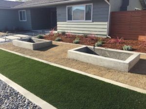 Artificial Turf, Cement Mow Strip, River Rock, Concrete Wall Planters, Concrete Pavers Path