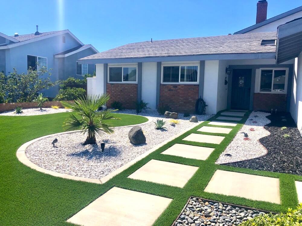 Front Yard in Clairemont area of San Diego with artificial turf, concrete pavers, rock ground cover, palm tree