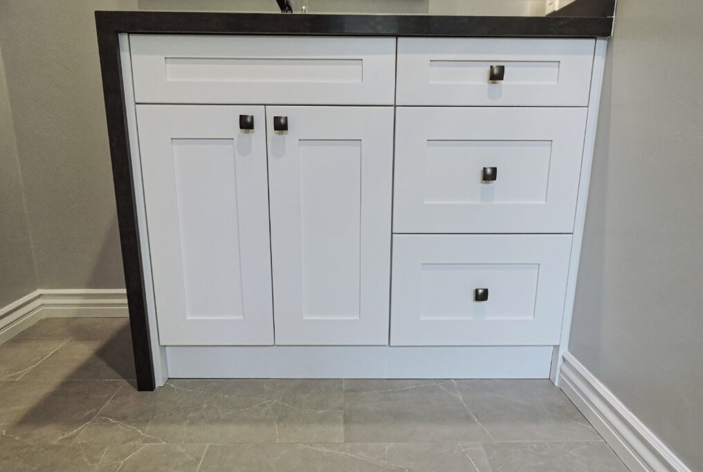 Bathroom vanity with white cabinetry